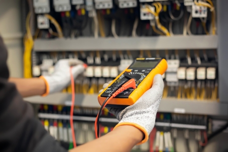 electrician tests an electrical system